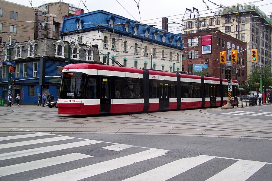 Red TTC streetcar on Spadina Avenue